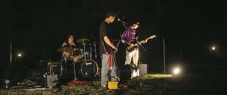 The band playing a gig outside
